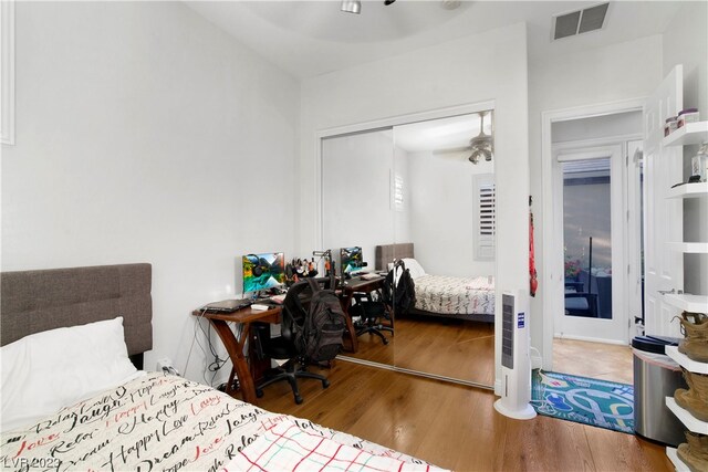 bedroom with a closet and light hardwood / wood-style flooring