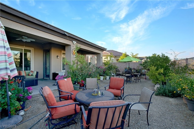 view of patio featuring ceiling fan