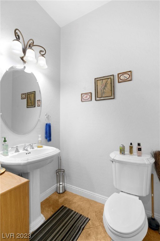 bathroom with toilet and tile flooring