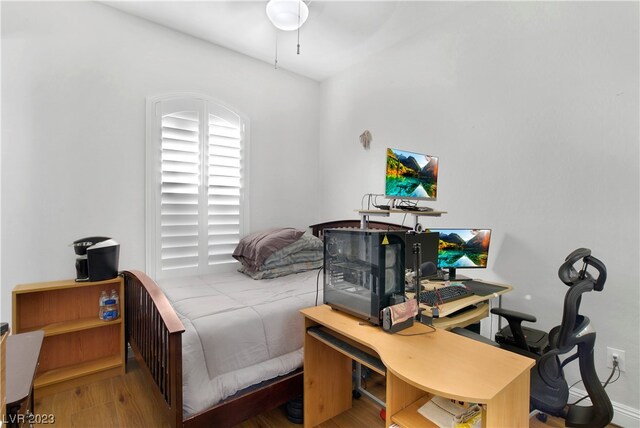 bedroom with hardwood / wood-style floors