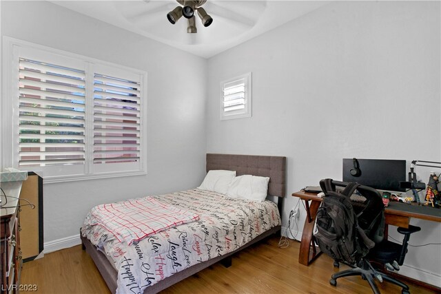 bedroom featuring light hardwood / wood-style flooring and ceiling fan