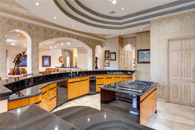 kitchen featuring a raised ceiling, sink, black dishwasher, and ornamental molding