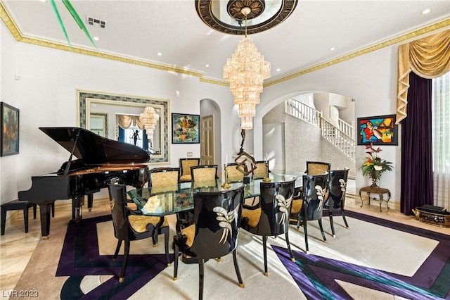 dining room with crown molding and an inviting chandelier