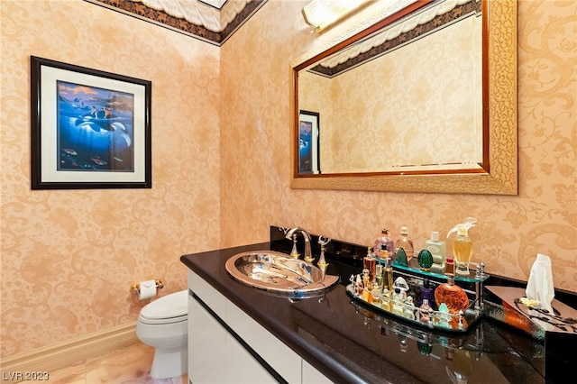 bathroom with vanity and toilet