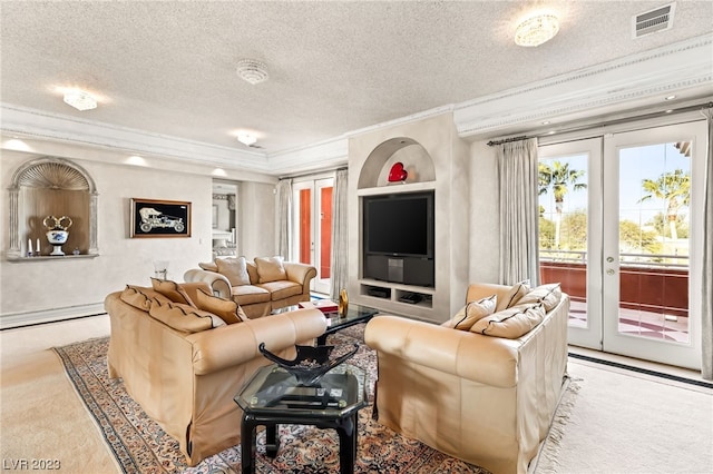 living room with light carpet, french doors, a textured ceiling, and ornamental molding