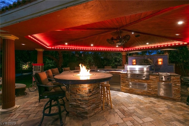 view of patio / terrace featuring area for grilling, exterior bar, and grilling area