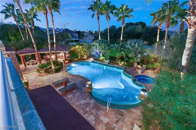 view of pool with a gazebo, an in ground hot tub, and a patio