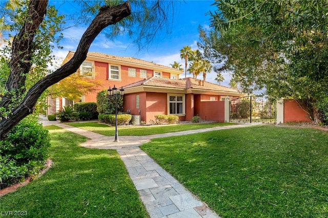 view of front of home featuring central AC unit and a front lawn