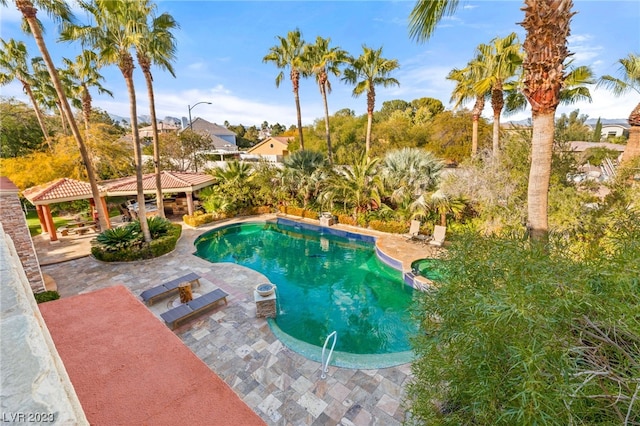 view of swimming pool with a gazebo and a patio