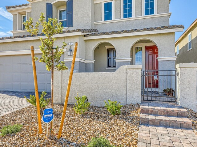 view of front of property with a garage