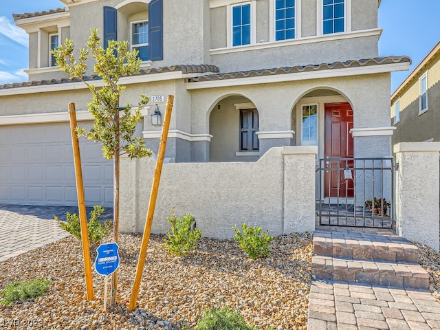 view of front of home with a garage