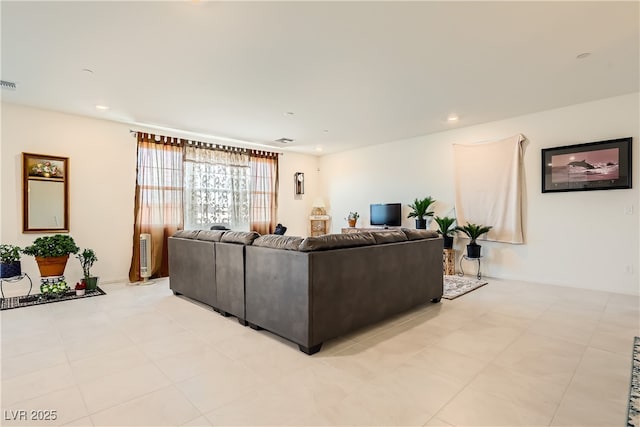 living room featuring recessed lighting and visible vents