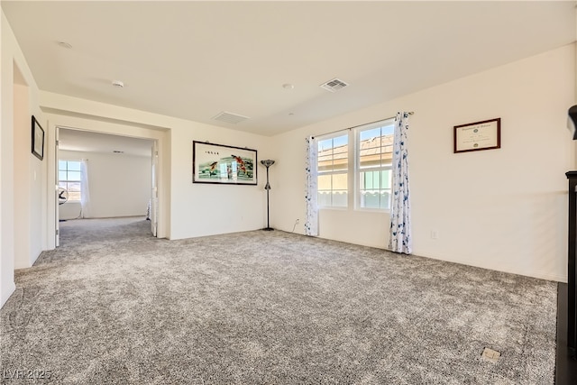 empty room with carpet and visible vents