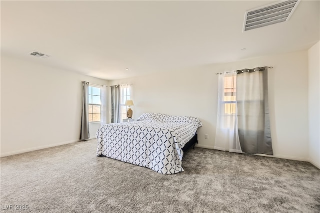 bedroom featuring carpet floors, baseboards, and visible vents