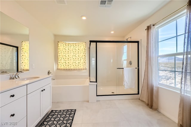 full bathroom featuring a stall shower, visible vents, vanity, and a bath