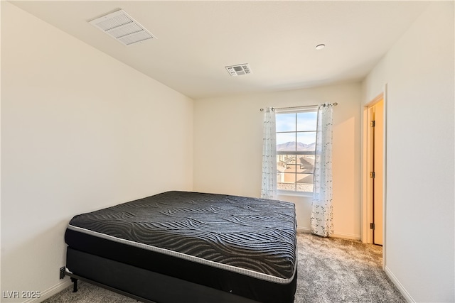 bedroom featuring carpet, visible vents, and baseboards