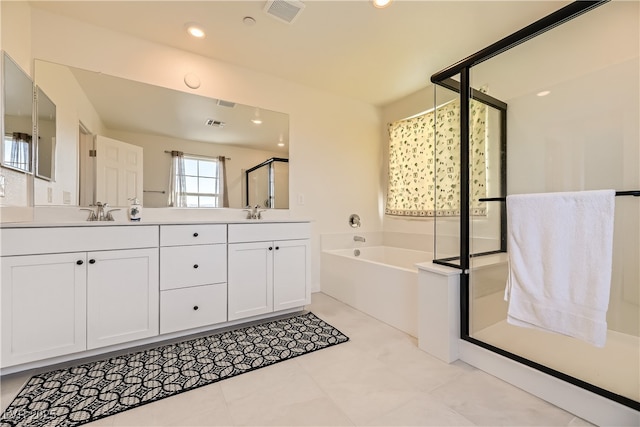 bathroom with a sink, visible vents, a bath, double vanity, and a stall shower