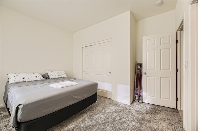 bedroom featuring a closet, carpet flooring, and baseboards