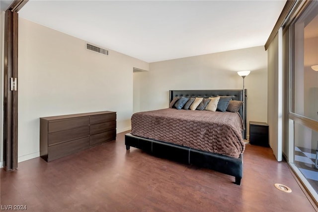 bedroom with hardwood / wood-style flooring