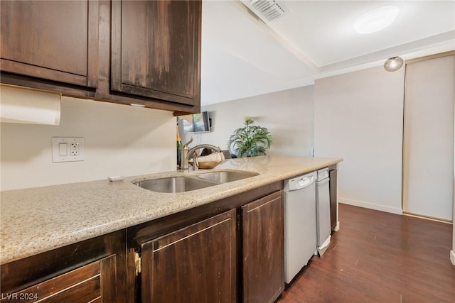 kitchen featuring sink, dark hardwood / wood-style flooring, dishwasher, and dark brown cabinetry