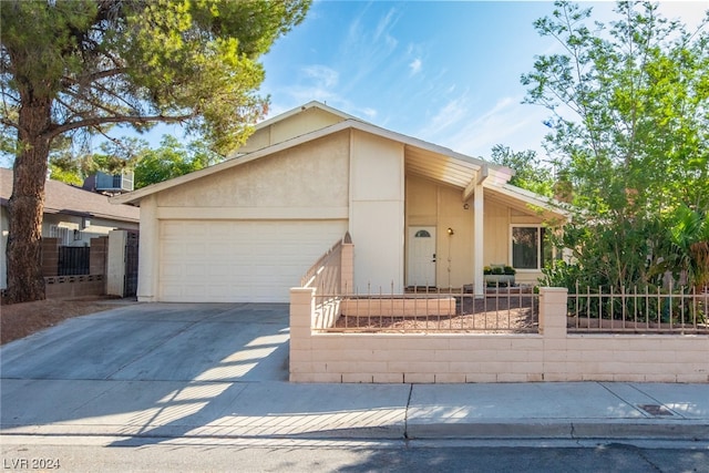 single story home featuring a garage