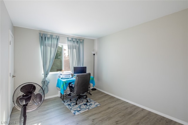 office with hardwood / wood-style flooring