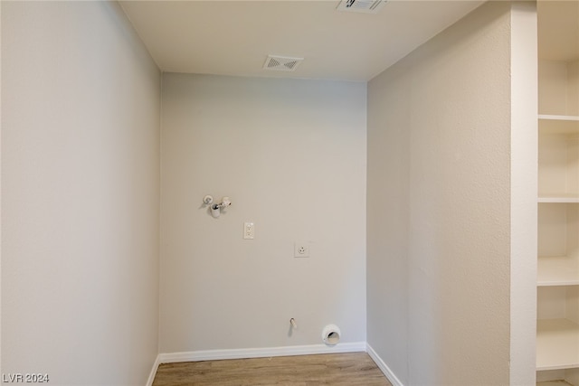 laundry area with light hardwood / wood-style flooring