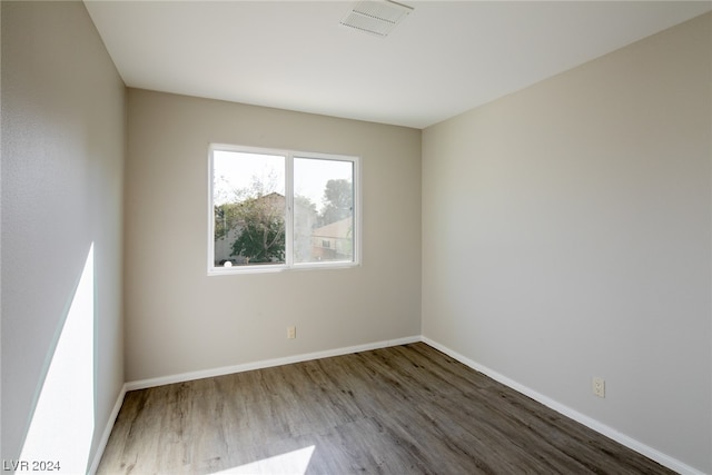 empty room with wood-type flooring