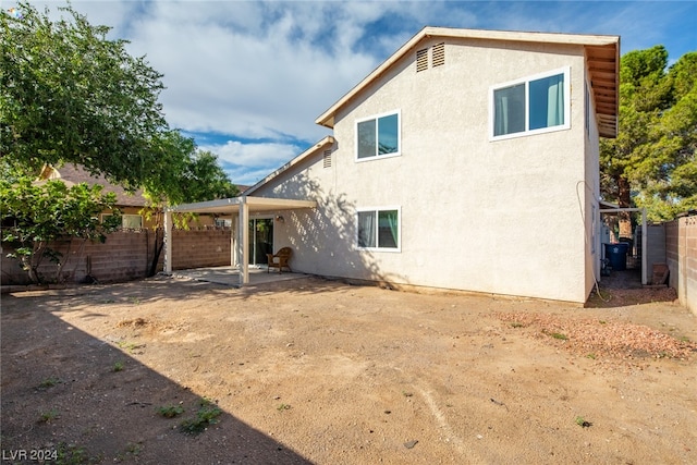 back of house featuring a patio area