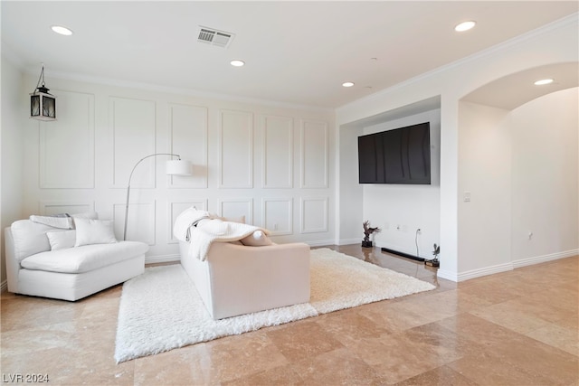 living room with ornamental molding