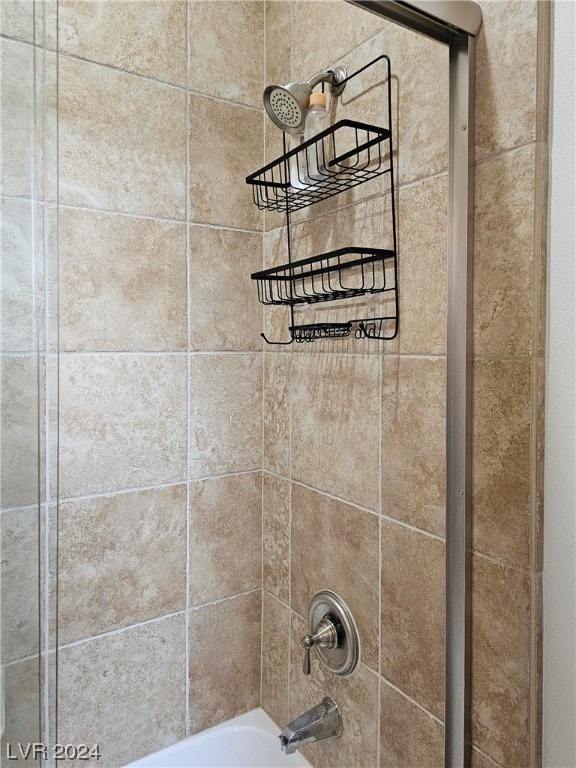 interior details featuring tiled shower / bath