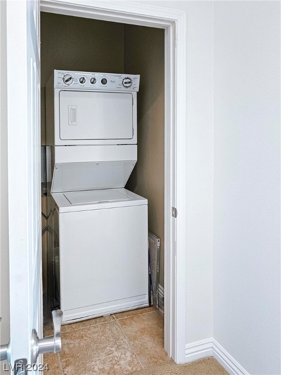 laundry room featuring stacked washing maching and dryer