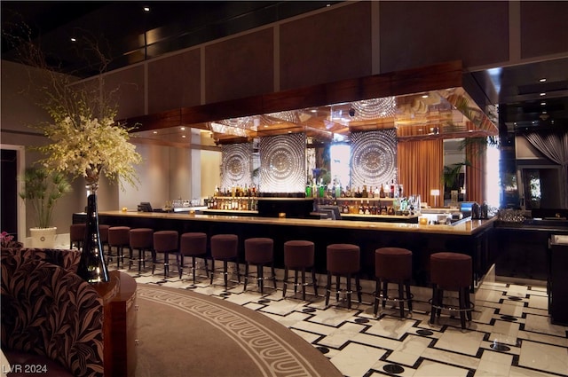 2000 N Fashion Show Dr Unit 1906, Las Vegas, NV 89109 - bar featuring a high ceiling and light tile floors