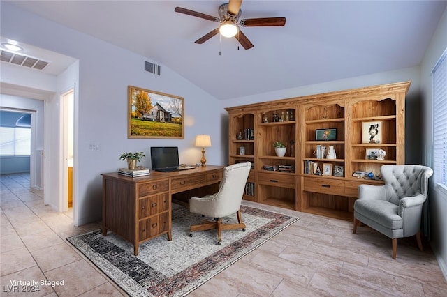 home office with ceiling fan, light tile patterned flooring, and vaulted ceiling