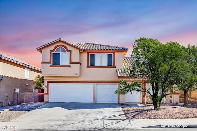 view of front of property with a garage