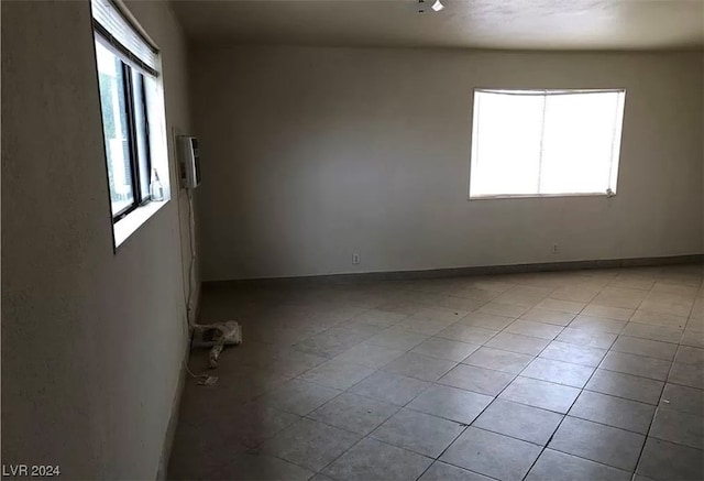 spare room with light tile flooring