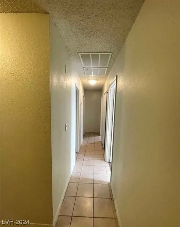 corridor with light tile flooring