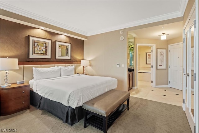 tiled bedroom with connected bathroom and crown molding