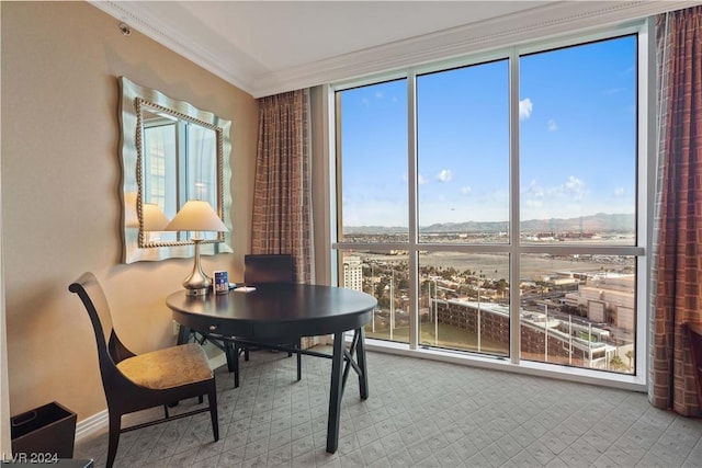 interior space featuring a wall of windows and ornamental molding