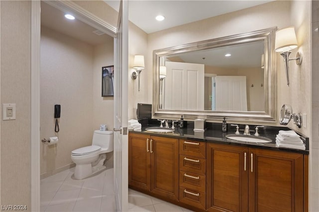 bathroom with tile patterned floors, vanity, and toilet