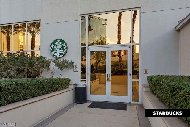 exterior entry at dusk with french doors