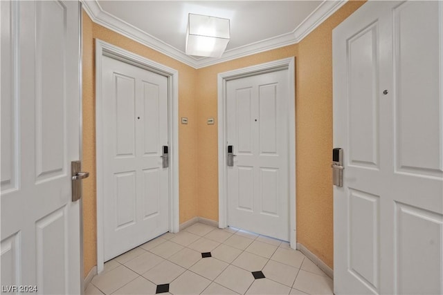 tiled foyer with crown molding