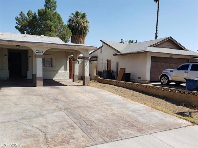 single story home featuring a garage