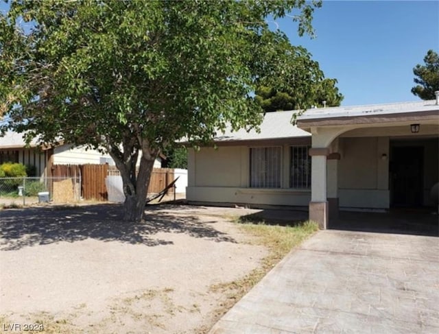 view of front of property with a carport