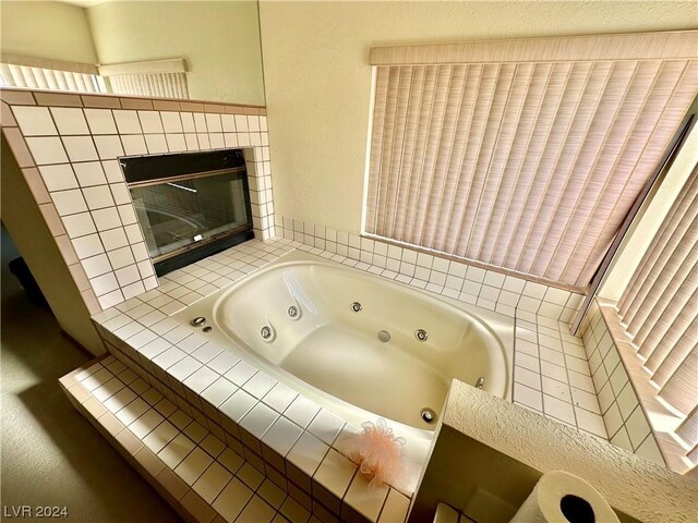 bathroom with tiled tub