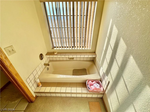 full bathroom with a wealth of natural light and a bath