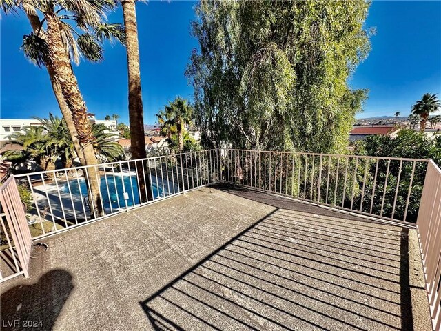 deck featuring a fenced in pool