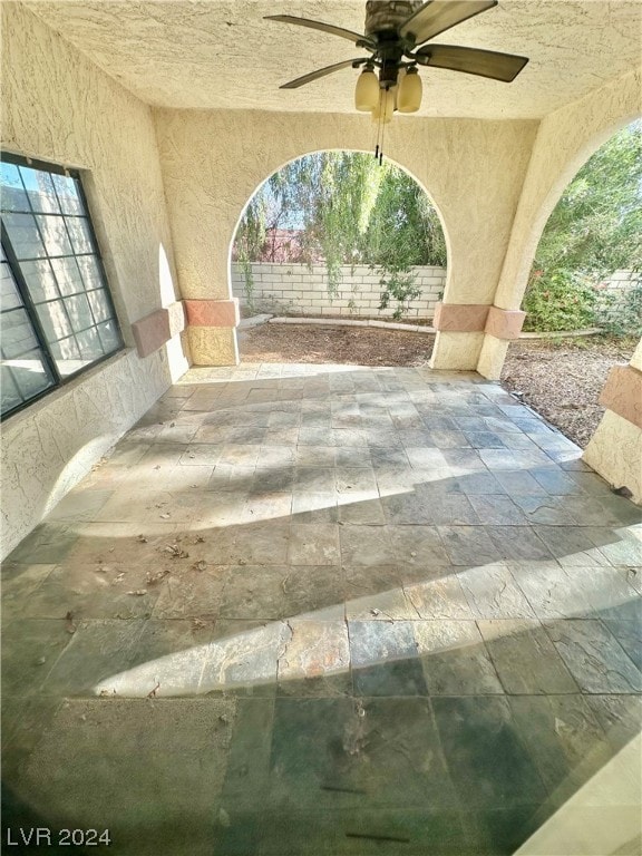 view of patio / terrace featuring ceiling fan