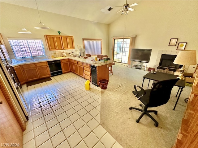 kitchen with light tile patterned flooring, kitchen peninsula, decorative light fixtures, high vaulted ceiling, and black dishwasher