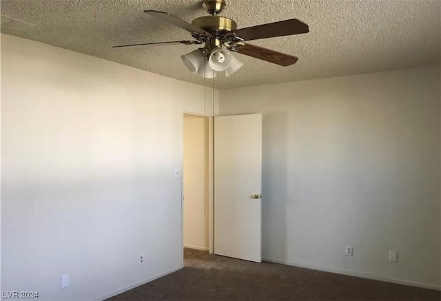 unfurnished room featuring ceiling fan, dark colored carpet, and a textured ceiling